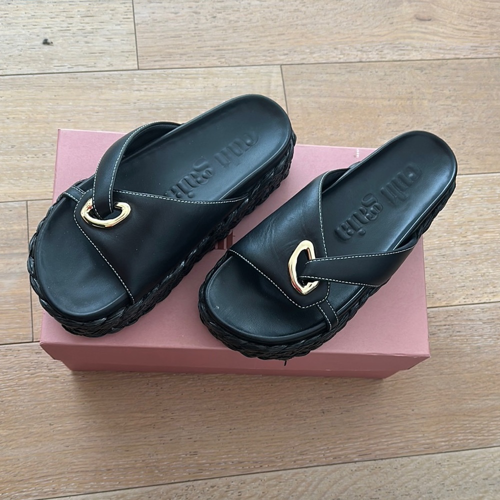 Cult Gaia Blythe black braided platforms with gold accent